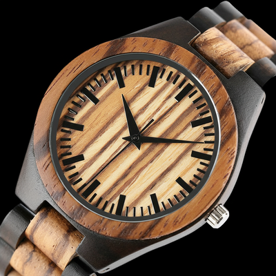 Wooden watch with black and red details on a white background