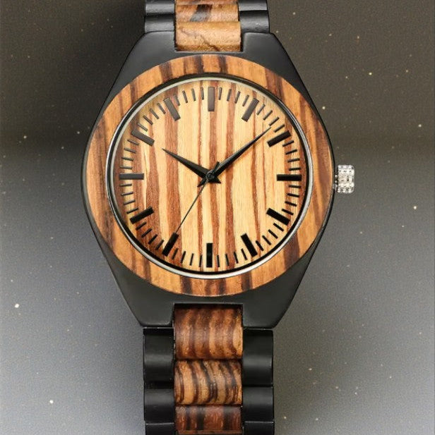 Wooden watch with black accents on a dark background