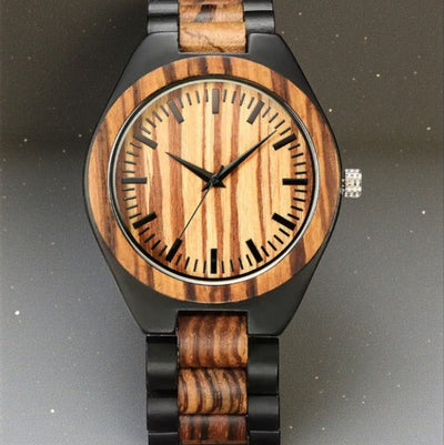 Wooden watch with black accents on a dark background