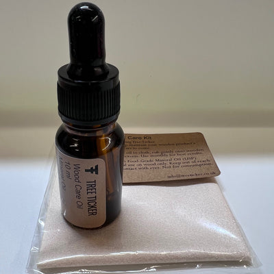 Wood oil care kit contents showing 10ml bottle and soft cloth